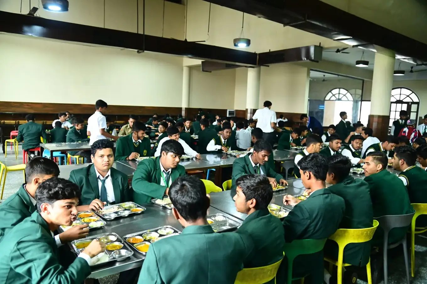 Boarders having a meal together in the dining hall at DPS Chhindwara