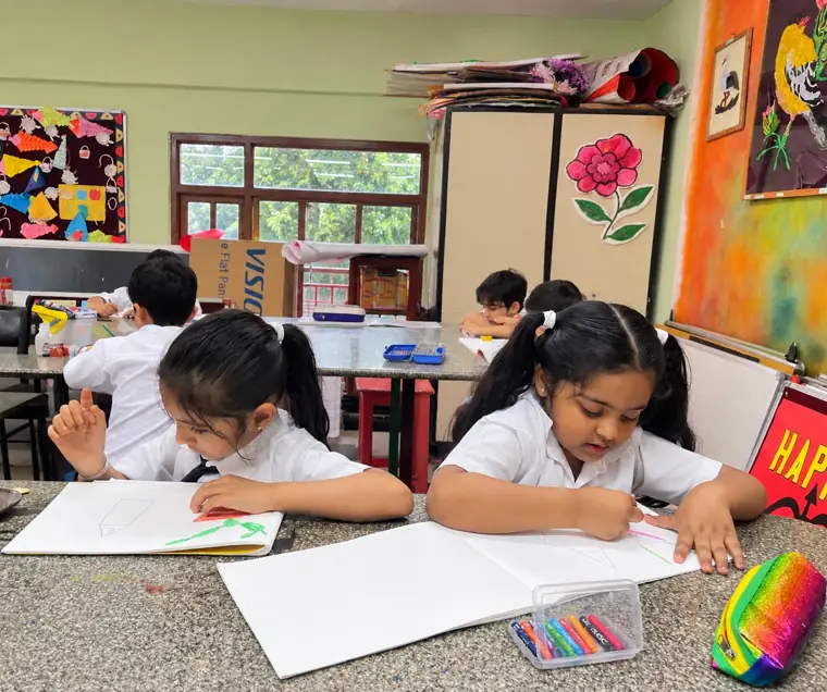Primary students drawing in class at DPS Chhindwara